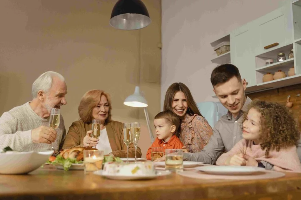 Family gathering around table enjoying peace of mind